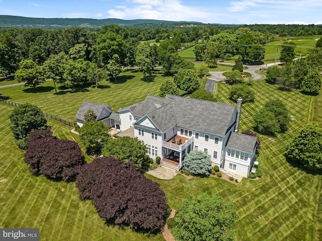 birds eye view of property with a rural view