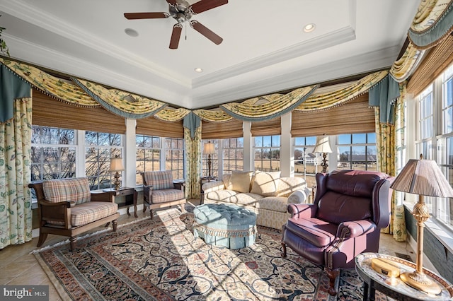 interior space featuring a raised ceiling and crown molding