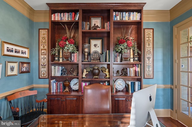 office with wood finished floors, crown molding, and baseboards
