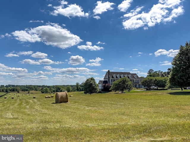 view of yard with a rural view