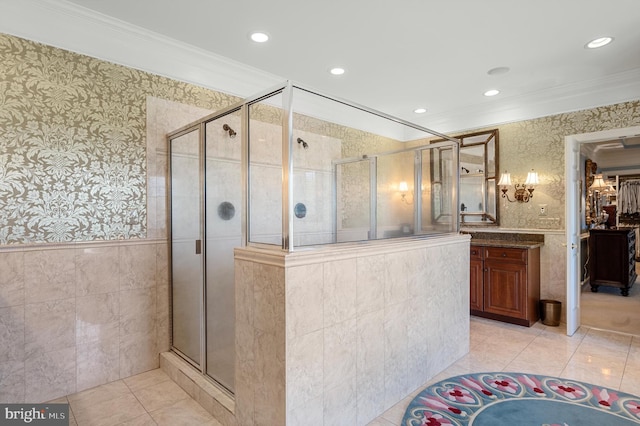 bathroom featuring tile patterned flooring, crown molding, and a shower with shower door