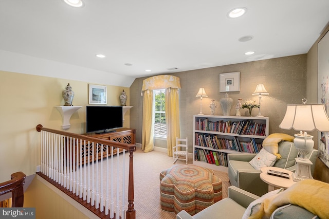 living area with baseboards, carpet flooring, recessed lighting, and an upstairs landing