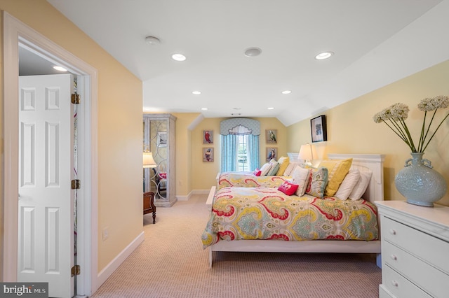 bedroom featuring lofted ceiling, baseboards, recessed lighting, and light colored carpet
