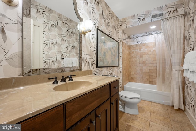 bathroom with toilet, visible vents, wallpapered walls, shower / tub combo with curtain, and vanity
