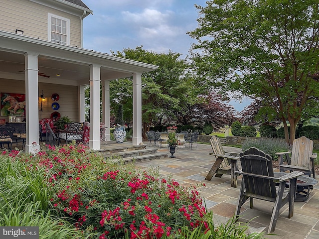 view of patio / terrace featuring an outdoor fire pit
