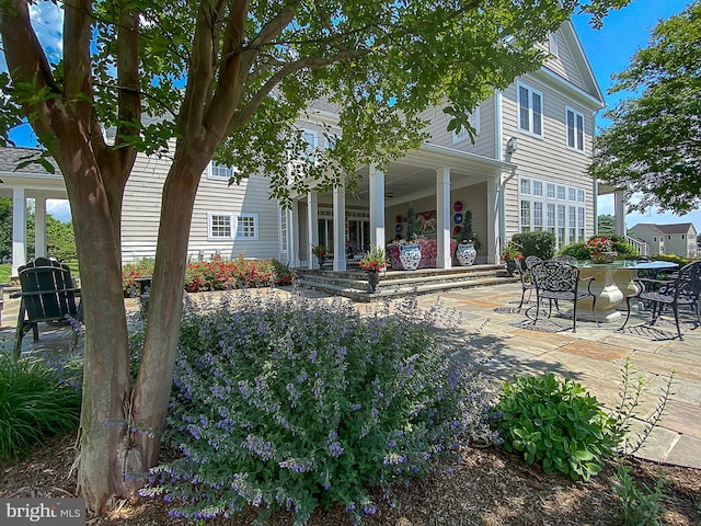 back of house with a patio area