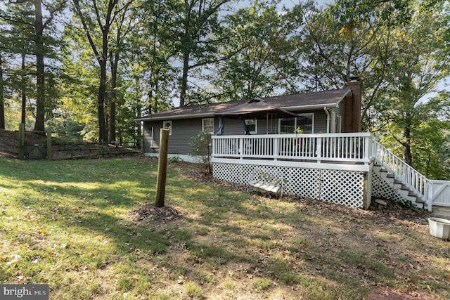 exterior space featuring a deck and a yard