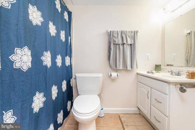 bathroom with vanity, tile patterned flooring, toilet, and a shower with curtain