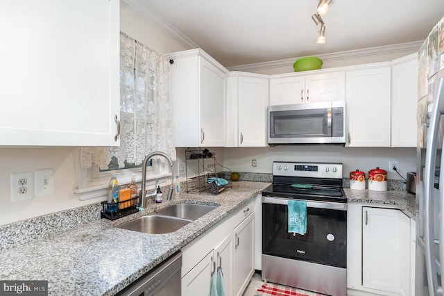 kitchen featuring stainless steel appliances, sink, and white cabinetry