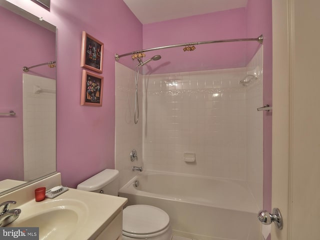 full bathroom with vanity, tiled shower / bath combo, and toilet