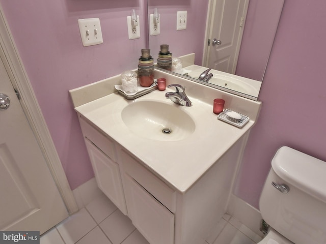 bathroom featuring vanity, toilet, and tile patterned floors