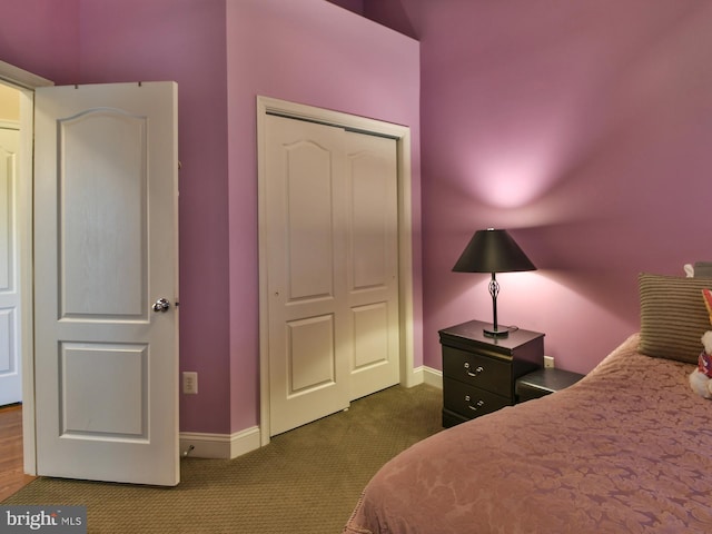 bedroom featuring dark colored carpet