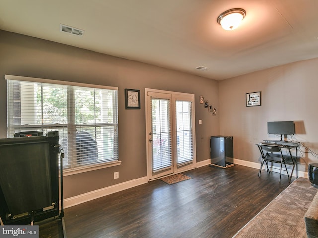 doorway with dark hardwood / wood-style flooring