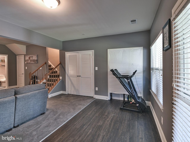 workout room with dark hardwood / wood-style floors