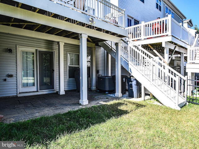 exterior space with a deck and central air condition unit