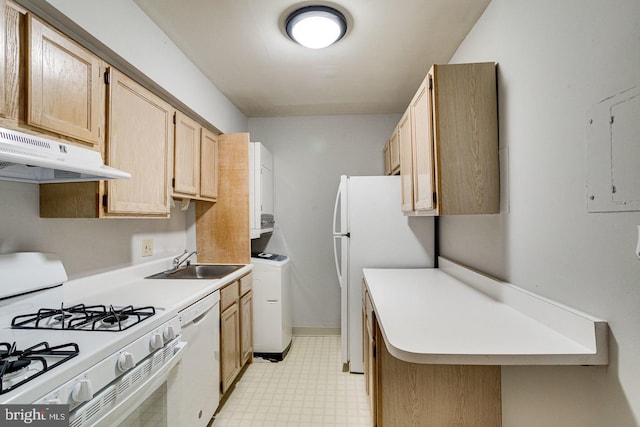 kitchen with washer / dryer, light brown cabinets, sink, and white appliances