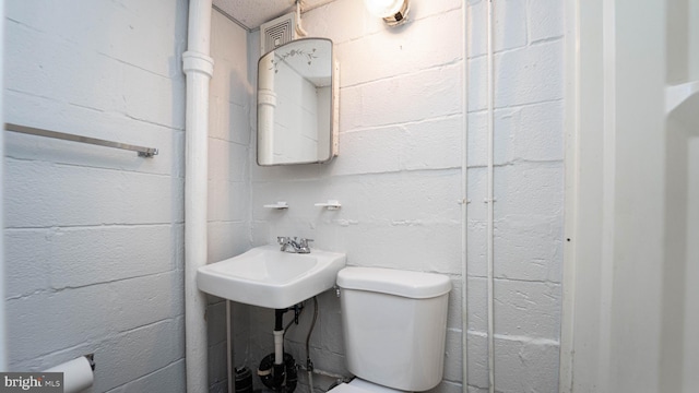 bathroom featuring sink and toilet