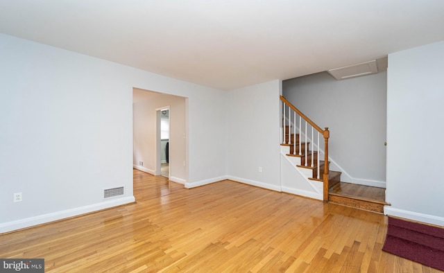 unfurnished room with light wood-type flooring