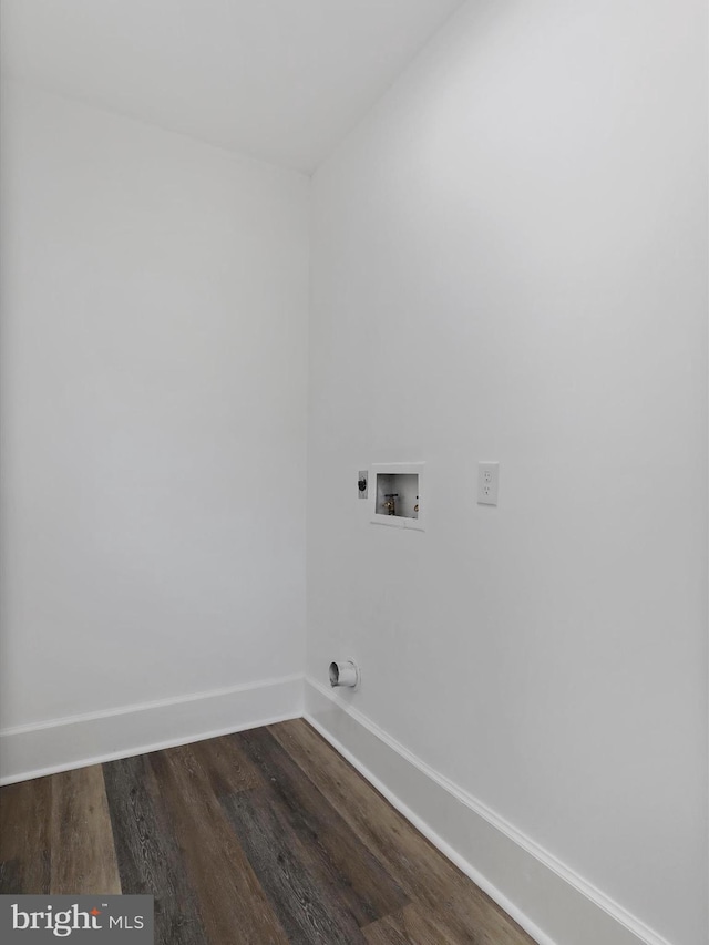 clothes washing area with hookup for an electric dryer, baseboards, dark wood-type flooring, laundry area, and washer hookup