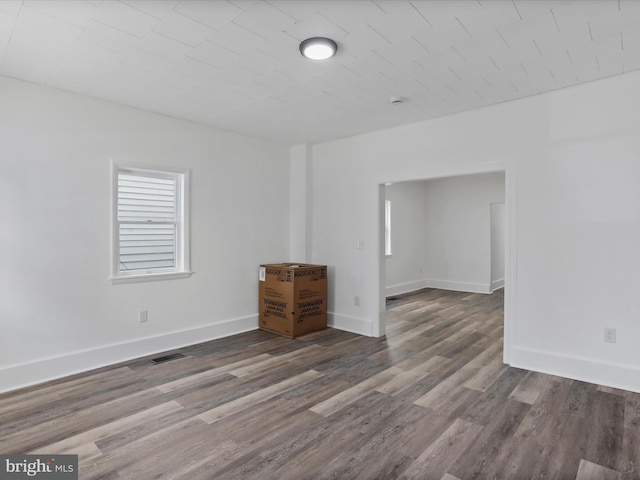 empty room with wood-type flooring