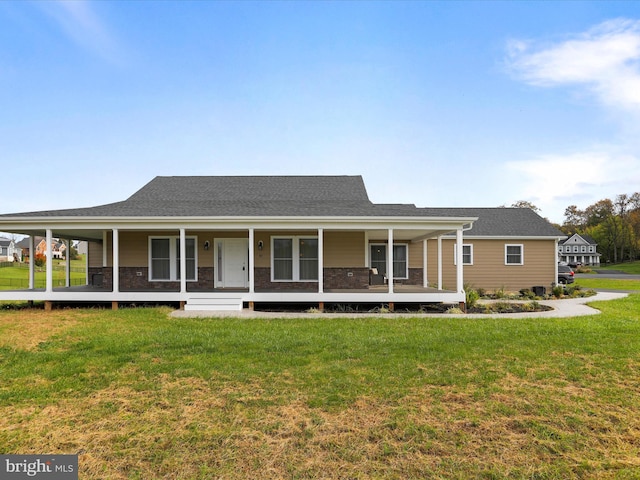 view of front of property with covered porch and a front lawn