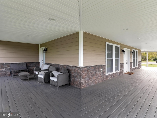 wooden deck with outdoor lounge area