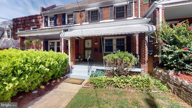 view of property with covered porch