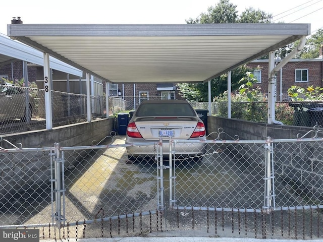 view of vehicle parking with a carport