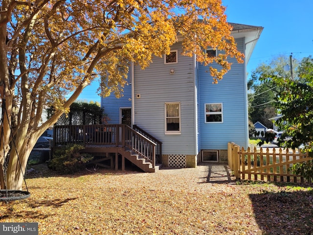 rear view of property with a deck