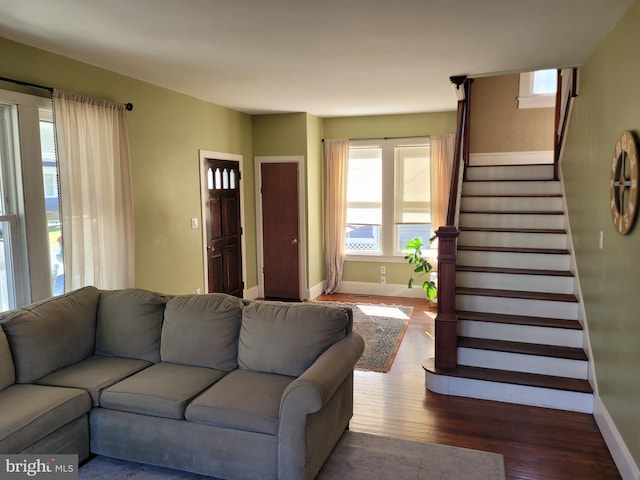 living room with dark hardwood / wood-style flooring