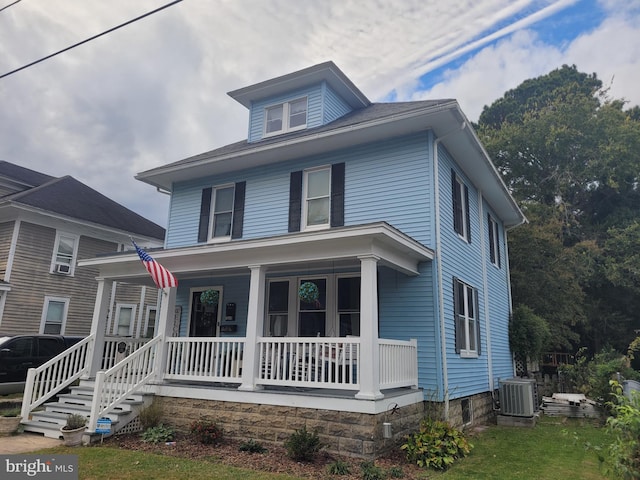 view of front of property featuring central air condition unit and a porch