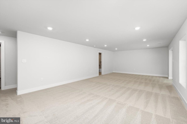 interior space featuring light colored carpet