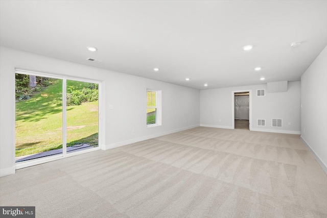 empty room featuring light colored carpet