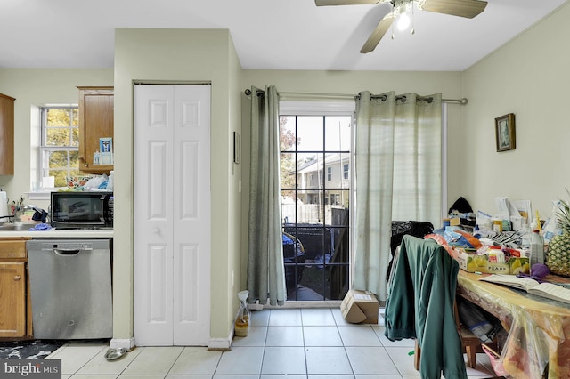 kitchen with ceiling fan, stainless steel dishwasher, sink, and light tile patterned floors