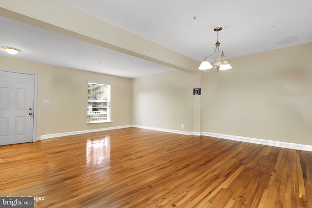 interior space with light hardwood / wood-style flooring and an inviting chandelier