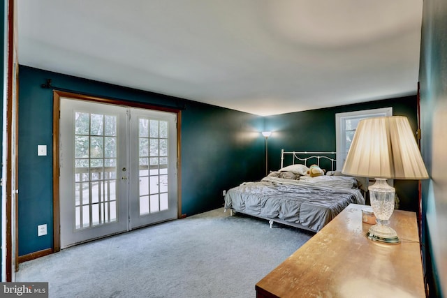 carpeted bedroom with french doors and access to exterior