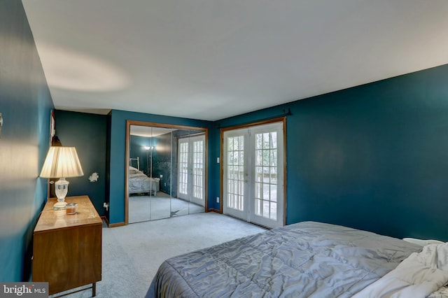 bedroom with french doors, a closet, and light colored carpet