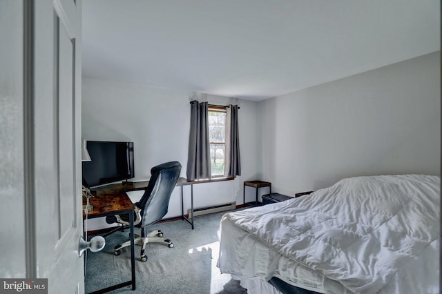 carpeted bedroom with baseboard heating