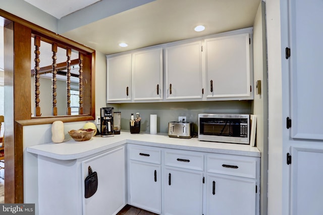 kitchen featuring white cabinetry