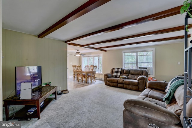 carpeted living room with ceiling fan, beamed ceiling, and cooling unit