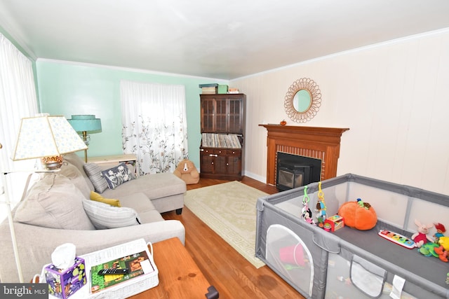 living room with ornamental molding and wood-type flooring