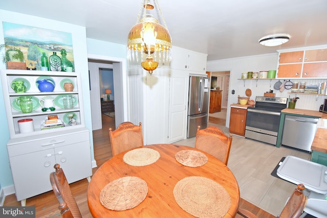 dining area with light wood-type flooring