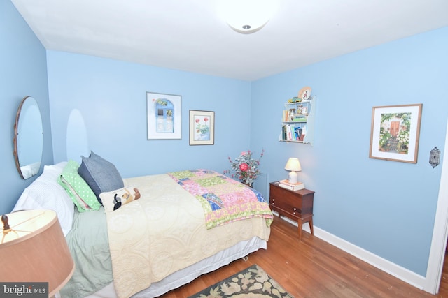 bedroom featuring hardwood / wood-style floors