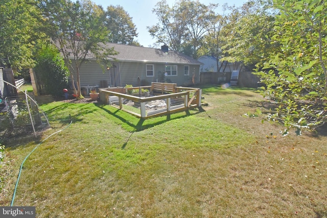 view of yard featuring a wooden deck