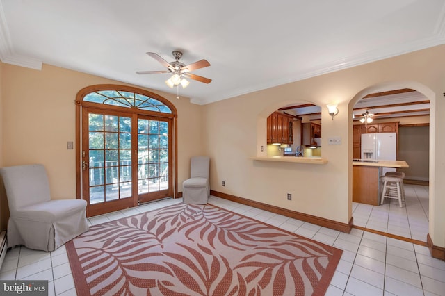 sitting room with ornamental molding, sink, ceiling fan, and light tile patterned floors