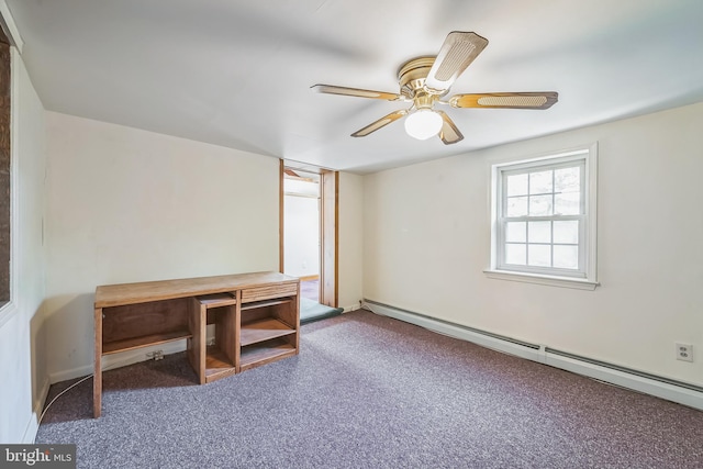 unfurnished office with baseboard heating, carpet, and ceiling fan