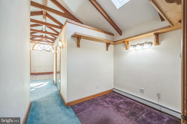 interior space with baseboard heating, carpet, and vaulted ceiling with skylight