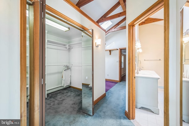 bathroom featuring vanity and vaulted ceiling with beams