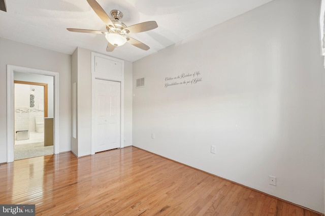 unfurnished bedroom featuring ceiling fan and hardwood / wood-style floors