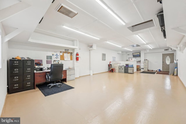 office area with concrete floors